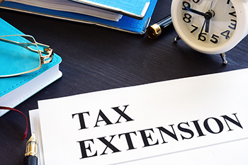Tax extension. Folder with documents and clock.