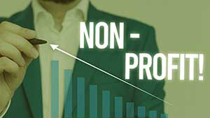 Nonprofit print on a clear screen with a business man showing growth