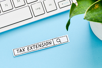 Tax extension text concept. Search line on blue background.