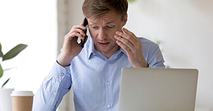 Man worried and frustrated on the phone #2