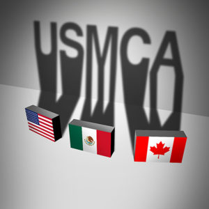 USMCA letters with the U.S., Canada and Mexico flags