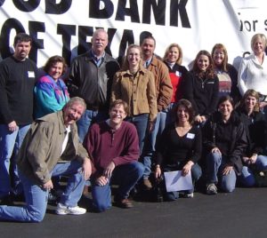 People Gathered and Giving Pose To A Photo