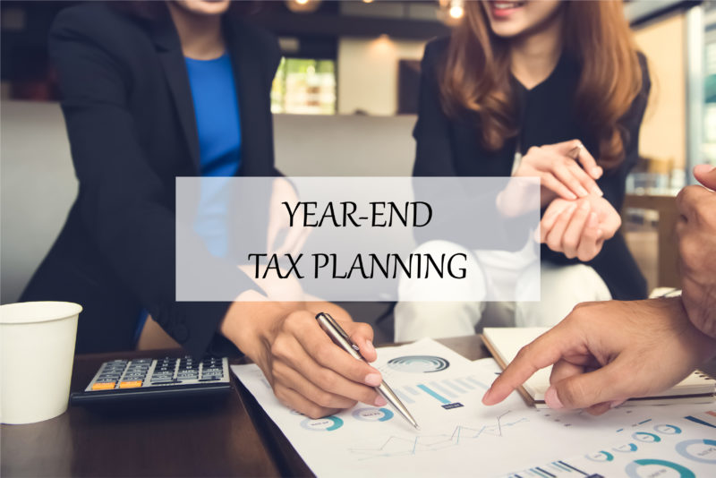 Advisor with client for year-end tax planning