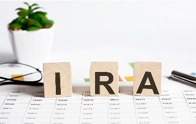 IRA regulations on wooden blocks on table