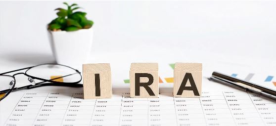 IRA regulations on wooden blocks on table